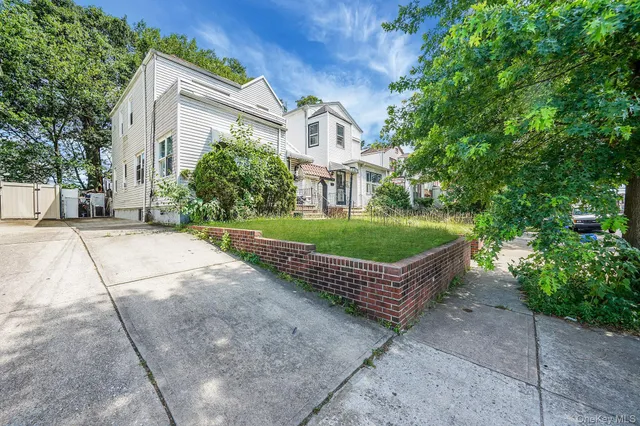 front view of a house with a garden