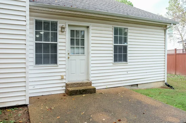 a view of a house with a door and a window