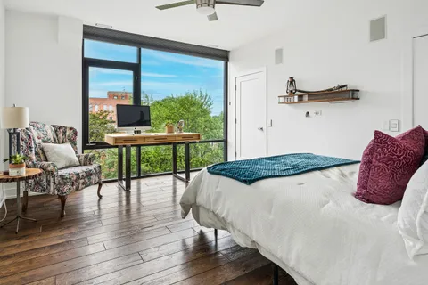 a bedroom with a bed and a table