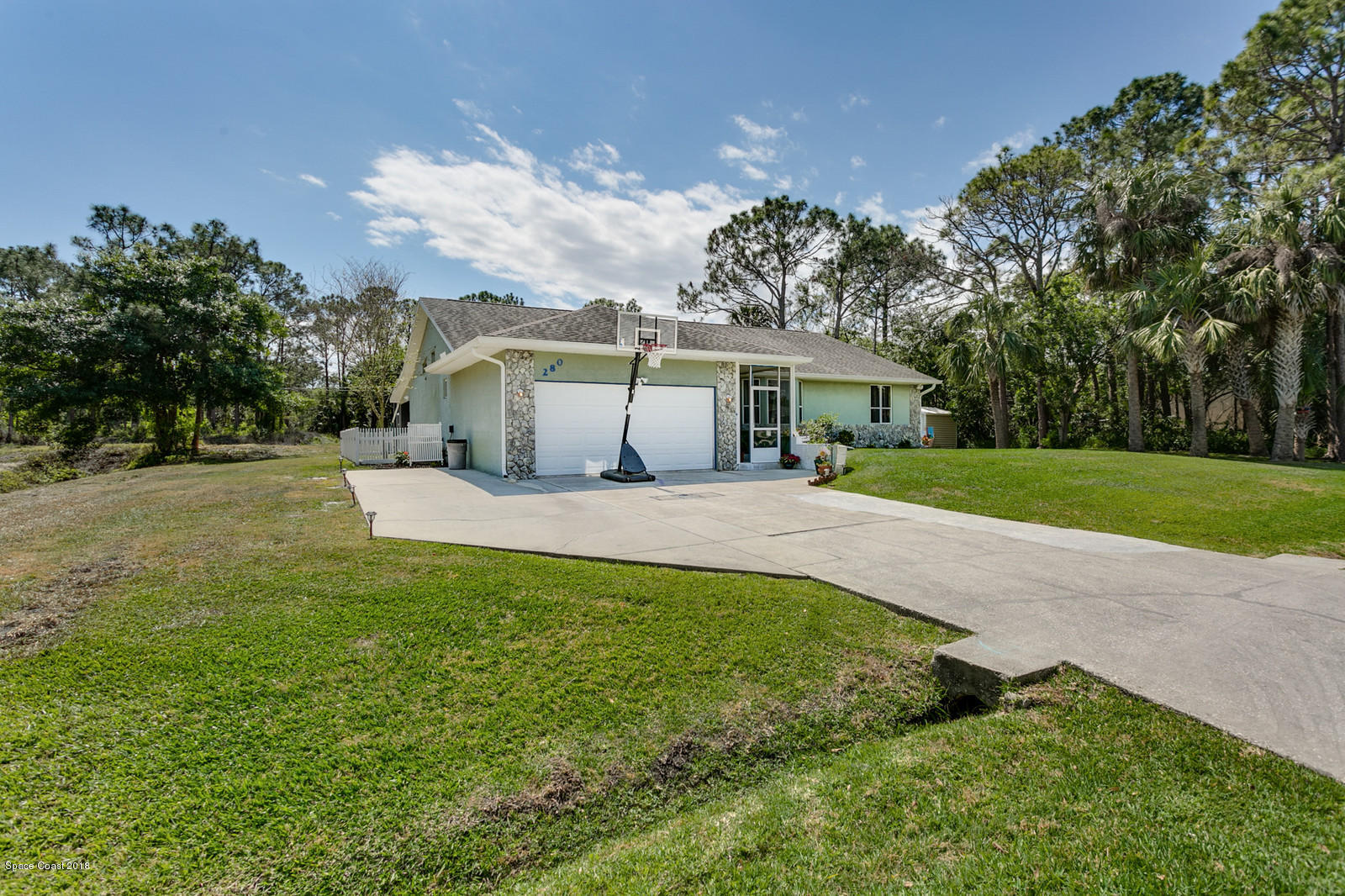 280 Rheine Road Northwest Palm Bay, FL 32907 - Photo 1 of 24 Front and Side Yard