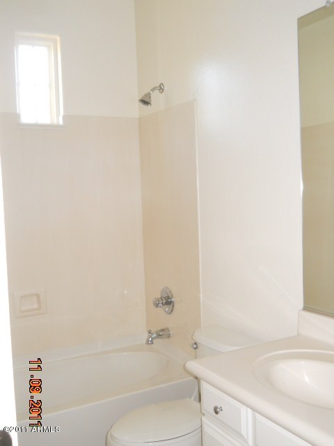 20864 West Ridge Road Buckeye, AZ 85396 - Photo 20 of 37 a bathroom with a bathtub and a sink