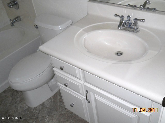 20864 West Ridge Road Buckeye, AZ 85396 - Photo 21 of 37 a bathroom with a toilet and a sink