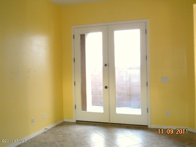 20864 West Ridge Road Buckeye, AZ 85396 - Photo 26 of 37 a view of a small space with wooden floor and a window