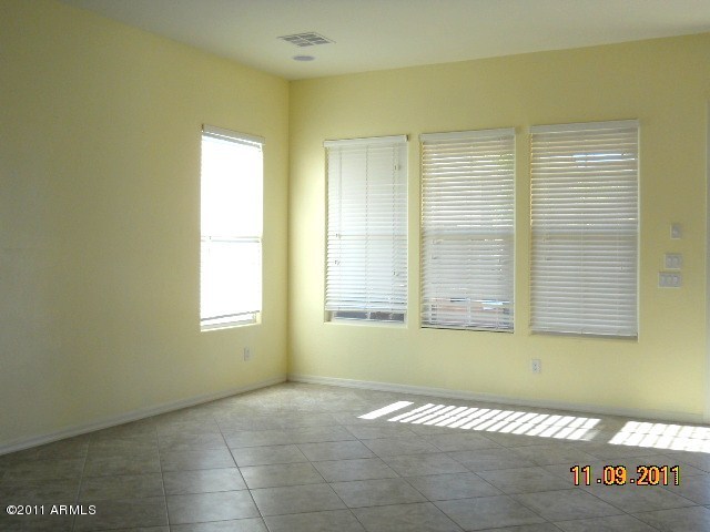 20864 West Ridge Road Buckeye, AZ 85396 - Photo 28 of 37 a view of an empty room with a window