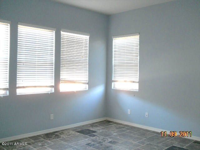 20864 West Ridge Road Buckeye, AZ 85396 - Photo 31 of 37 a view of empty room with windows