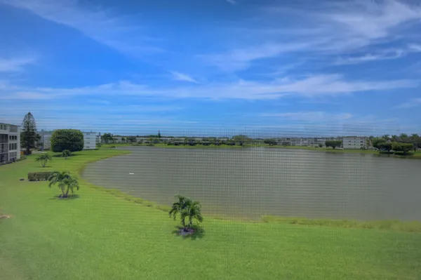 a view of a lake with a yard