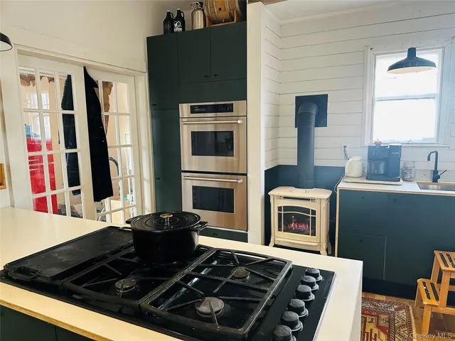 a bedroom with a bed and book shelf