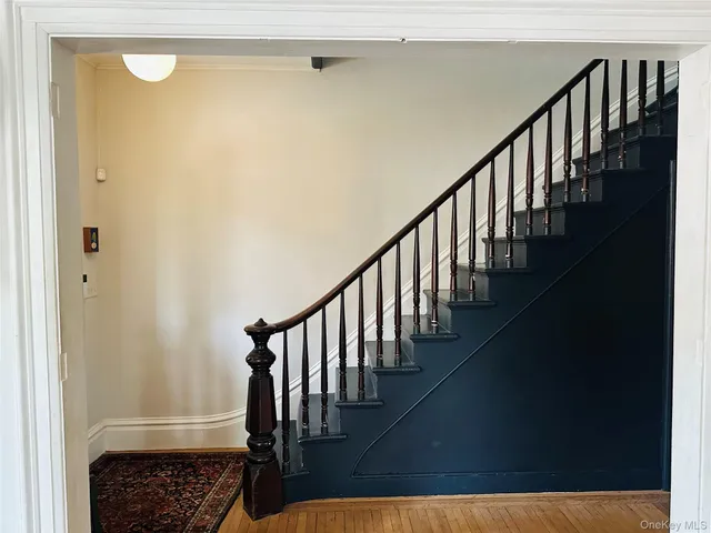 a view of entryway with wooden floor