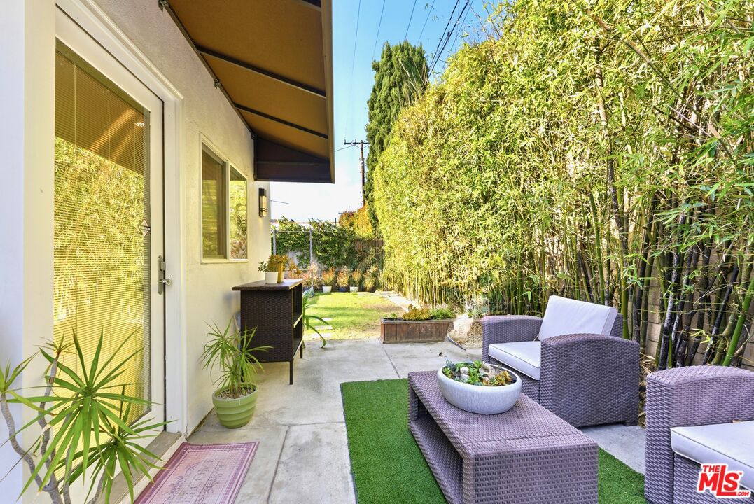 132 North Carson Road, Unit A Beverly Hills, CA 90211 - Photo 14 of 14 a view of a patio with couches table and chairs and potted plants