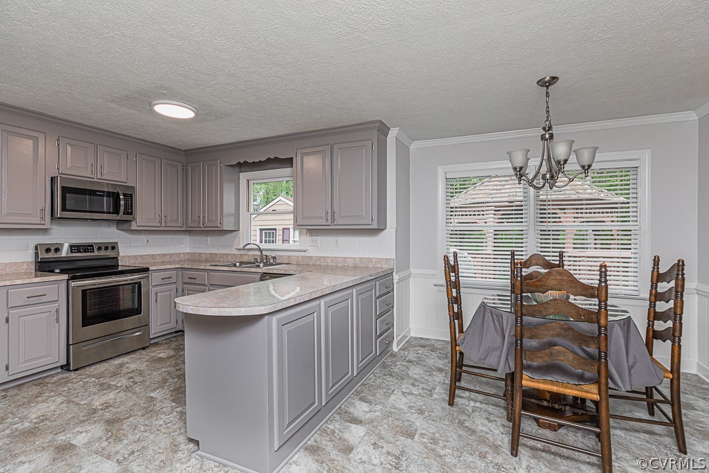 14209 Long Hill Road Midlothian, VA 23112 - Photo 13 of 50 a kitchen with kitchen island granite countertop a sink center island and stainless steel appliances