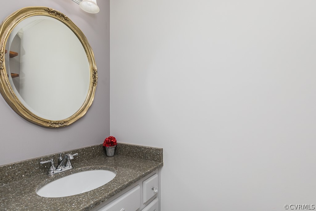 14209 Long Hill Road Midlothian, VA 23112 - Photo 20 of 50 a bathroom with a sink and a mirror