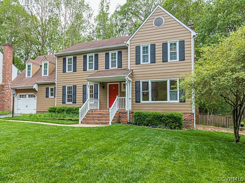 14209 Long Hill Road Midlothian, VA 23112 - Photo 2 of 50 a front view of a house with a yard