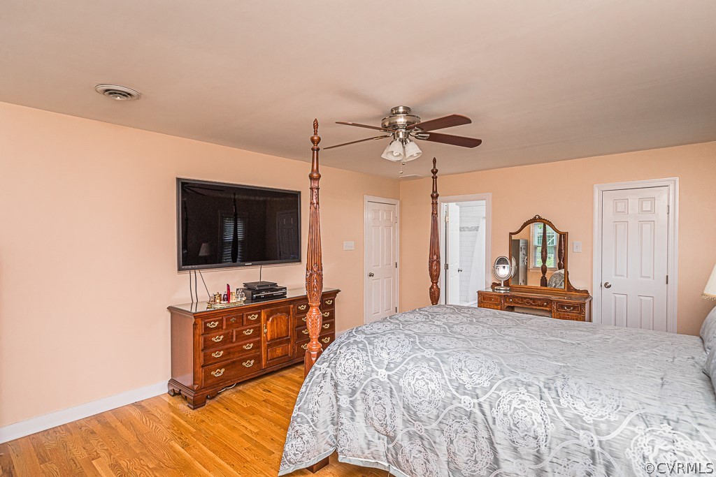 14209 Long Hill Road Midlothian, VA 23112 - Photo 27 of 50 a bedroom with a bed and a flat screen tv