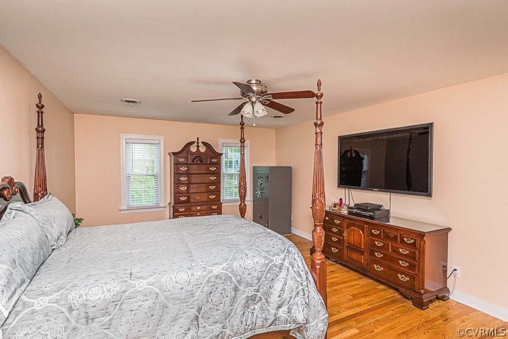 14209 Long Hill Road Midlothian, VA 23112 - Photo 29 of 50 a bedroom with a bed and a flat screen tv