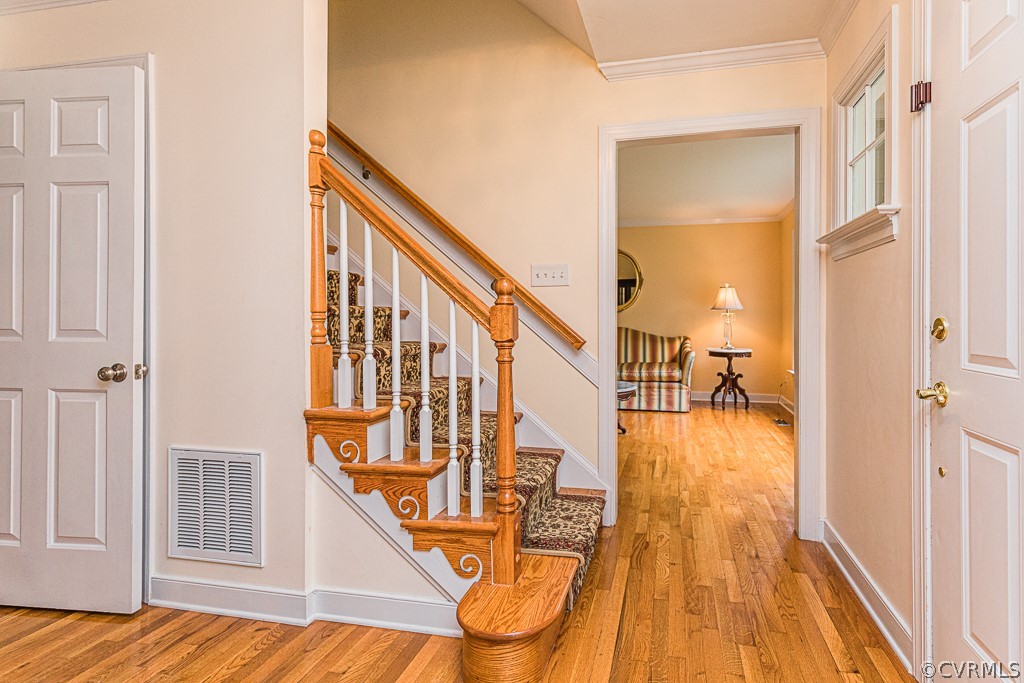 14209 Long Hill Road Midlothian, VA 23112 - Photo 3 of 50 a view of an entryway with wooden floor and staircase