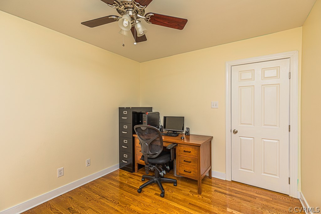14209 Long Hill Road Midlothian, VA 23112 - Photo 32 of 50 a view of a workspace with furniture and wooden floor