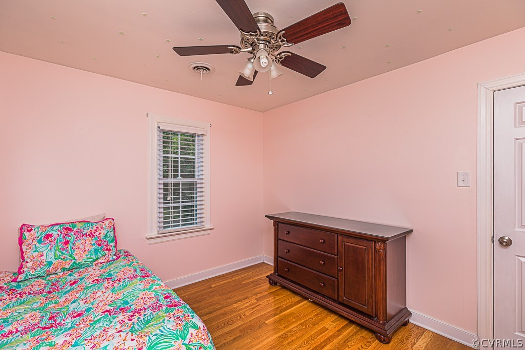 14209 Long Hill Road Midlothian, VA 23112 - Photo 35 of 50 a bedroom with a bed and a dresser