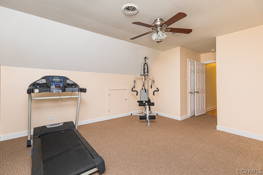14209 Long Hill Road Midlothian, VA 23112 - Photo 38 of 50 a room with gym equipment and a chandelier