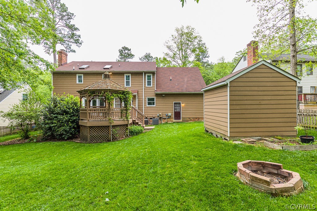 14209 Long Hill Road Midlothian, VA 23112 - Photo 48 of 50 a front view of a house with a garden and plants