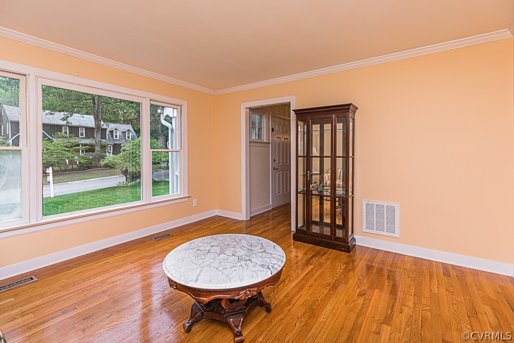 14209 Long Hill Road Midlothian, VA 23112 - Photo 6 of 50 a view of an empty room with a window and wooden floor