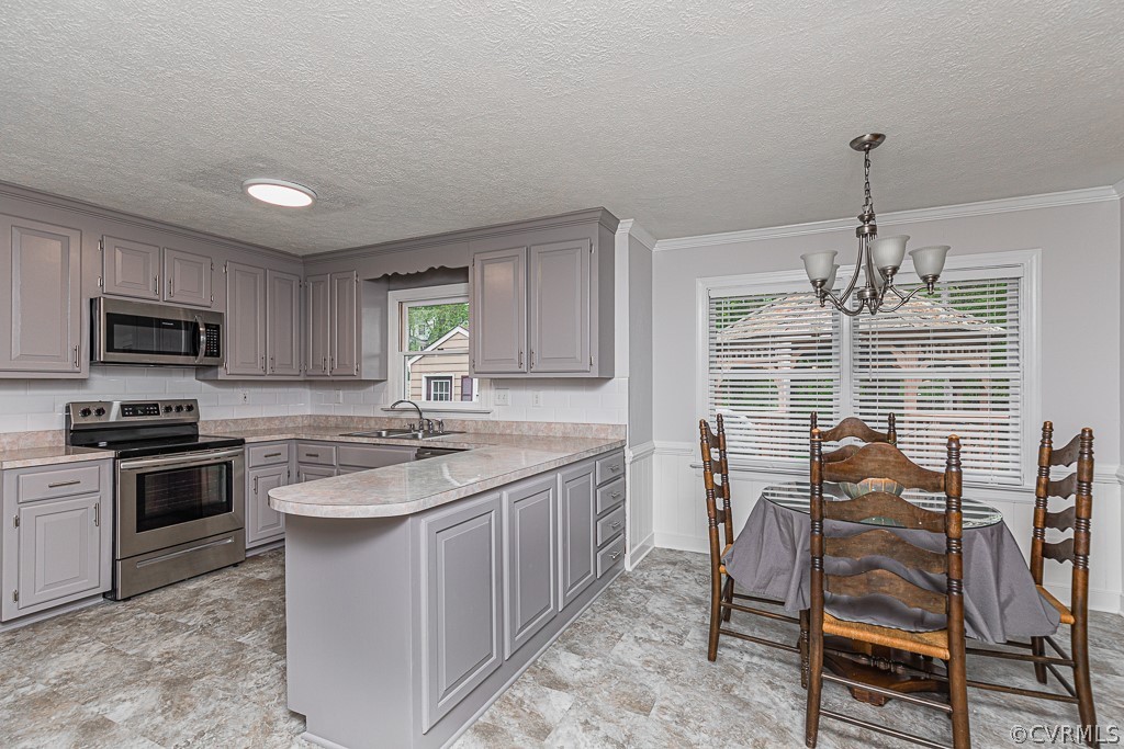 14209 Long Hill Road Midlothian, VA 23112 - Photo 10 of 50 a kitchen with stainless steel appliances granite countertop a stove top oven a sink dishwasher a dining table and chairs with wooden floor