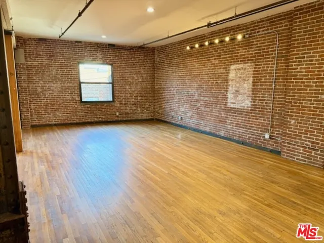 a view of a livingroom with wooden floor