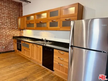 a kitchen with a refrigerator and a stove