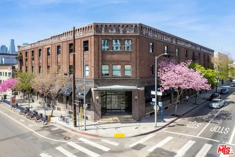 a front view of building with yard
