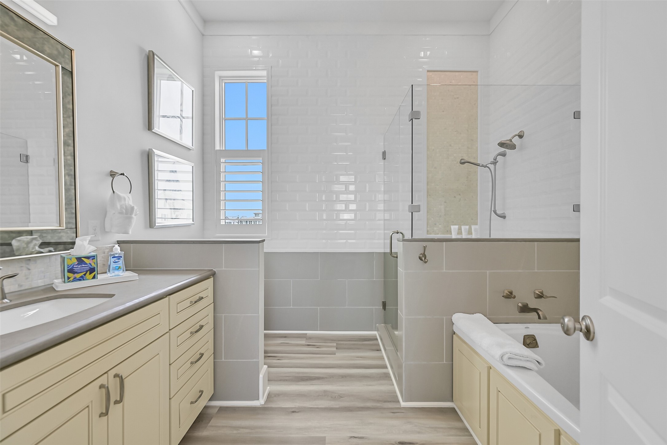 817 Positano Road Galveston, TX 77550 - Photo 5 of 50 Designed with relaxation in mind, the primary bath features vanity with ample space, a soaking tub, and an oversized walk-in shower. Spa-inspired finishes create a peaceful escape within the home.