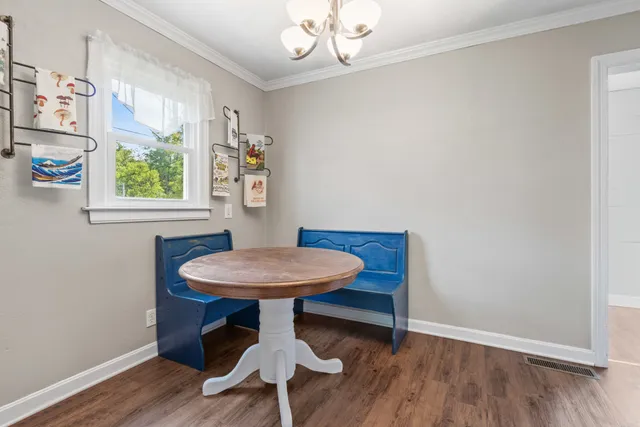 a view of a room with furniture window and wooden floor