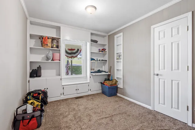 a view of room with toys and wooden floor