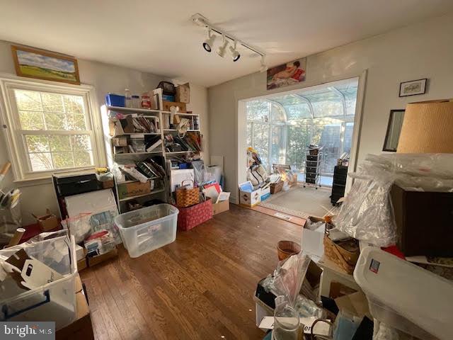 6211 Madawaska Road Bethesda, MD 20816 - Photo 12 of 24 a living room with furniture a fireplace and a flat screen tv