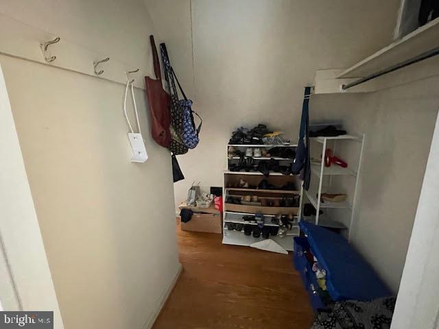 6211 Madawaska Road Bethesda, MD 20816 - Photo 18 of 24 a view of walk in closet with clothes and shoes