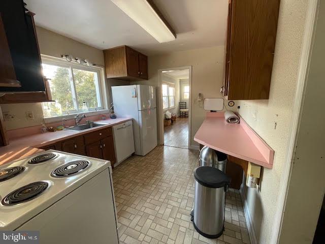 6211 Madawaska Road Bethesda, MD 20816 - Photo 10 of 24 a kitchen with a sink appliances and cabinets