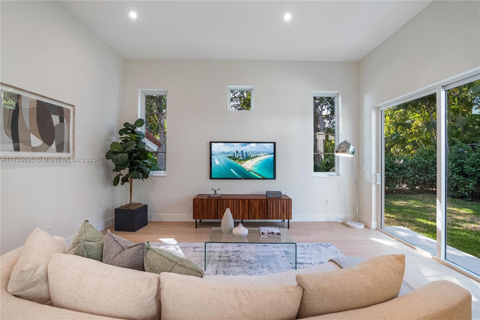 625 Jeronimo Drive Coral Gables, FL 33146 - Photo 12 of 30 a living room with furniture and a large window