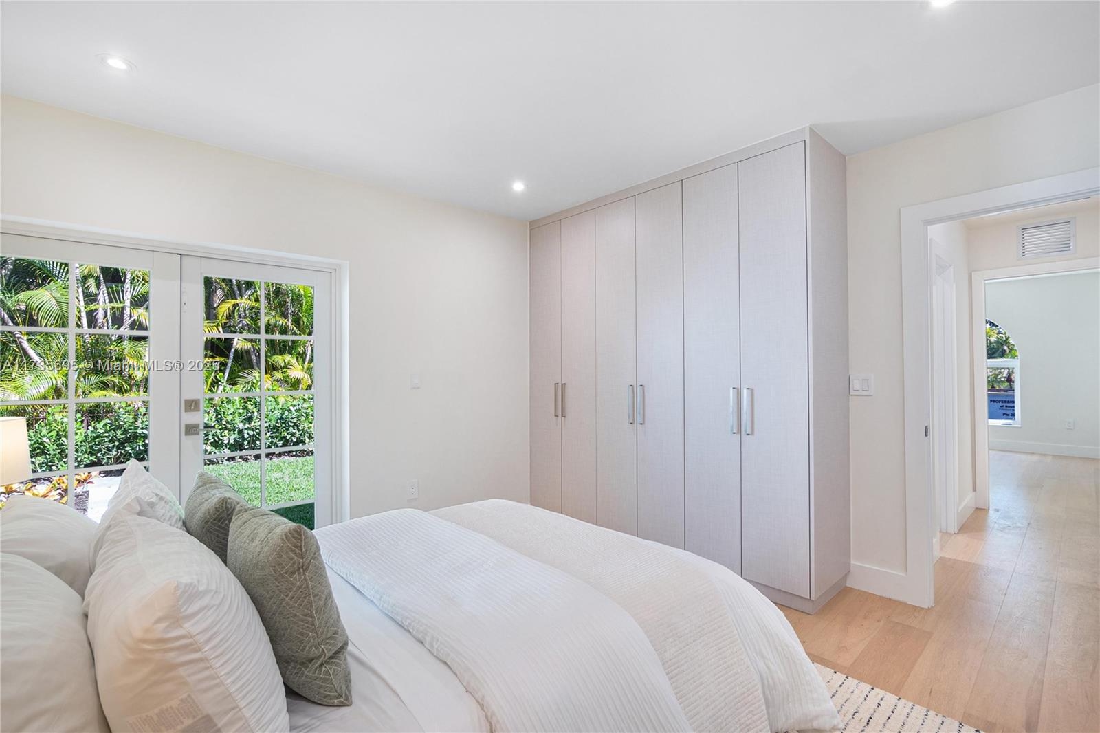 625 Jeronimo Drive Coral Gables, FL 33146 - Photo 23 of 30 a bedroom with a bed and a window