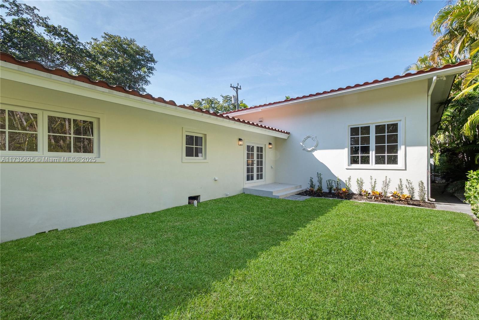 625 Jeronimo Drive Coral Gables, FL 33146 - Photo 30 of 30 a backyard of a house with seating space
