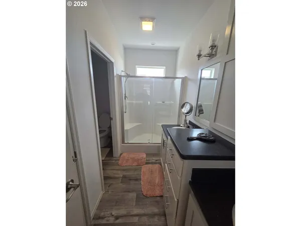 a room with a sink and a mirror