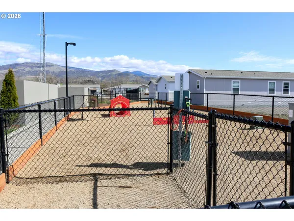 a view of an outdoor space and tennis court