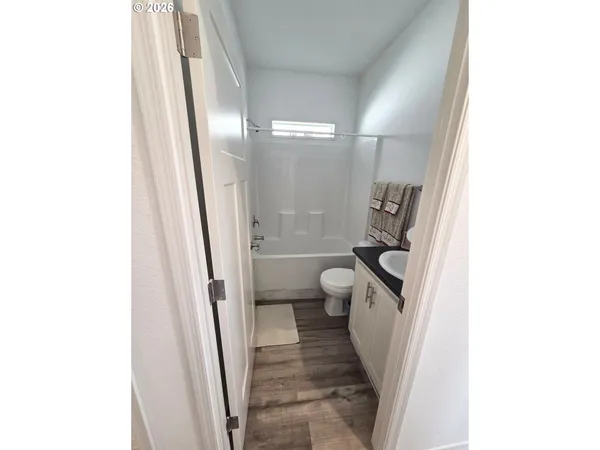 a bathroom with a sink and toilet