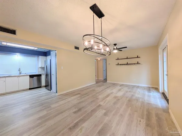 a view of a livingroom with wooden floor