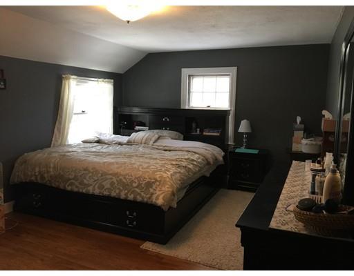 25 Hartwick Street Springfield, MA 01108 - Photo 14 of 18 a bedroom with a bed and a dresser next to a window