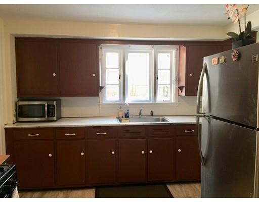 25 Hartwick Street Springfield, MA 01108 - Photo 3 of 18 a kitchen with a refrigerator and a sink