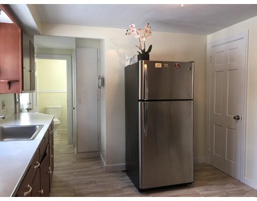 25 Hartwick Street Springfield, MA 01108 - Photo 4 of 18 a kitchen with a refrigerator and a sink