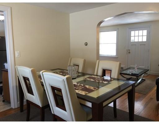 25 Hartwick Street Springfield, MA 01108 - Photo 8 of 18 a room that has a table and chairs in it