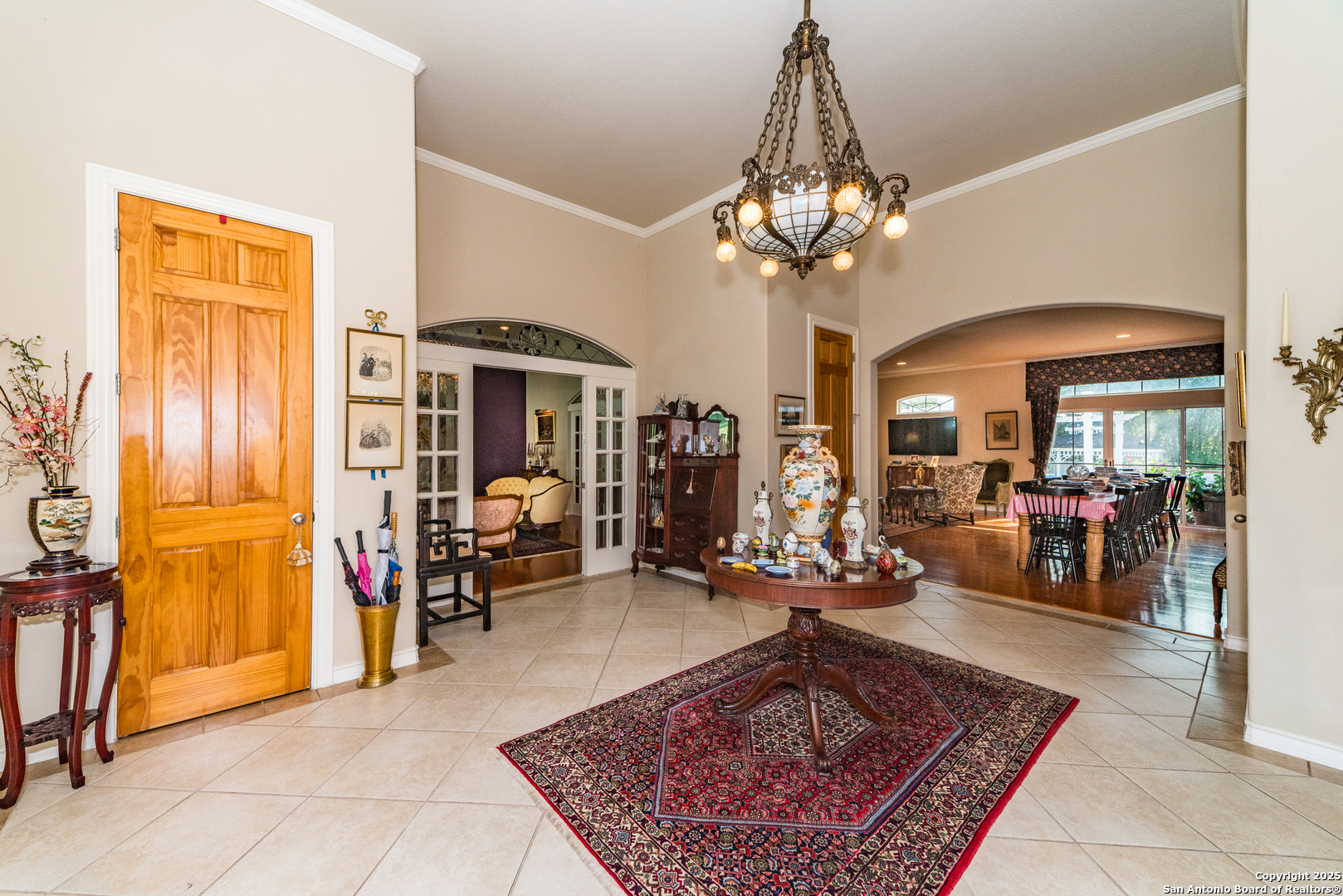 7226 North Vandiver Road San Antonio, TX 78209 - Photo 11 of 59 a living room with furniture a chandelier and a rug