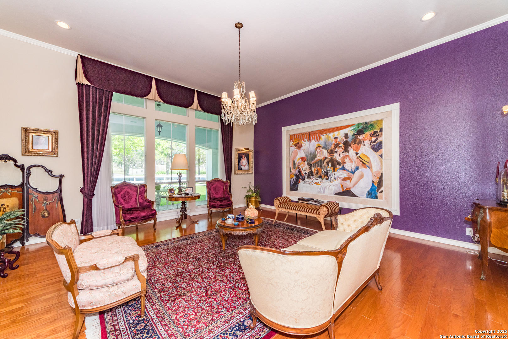 7226 North Vandiver Road San Antonio, TX 78209 - Photo 13 of 59 a living room with furniture a rug and a chandelier