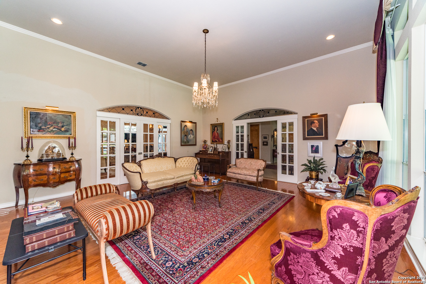 7226 North Vandiver Road San Antonio, TX 78209 - Photo 15 of 59 a living room with furniture a chandelier and a table