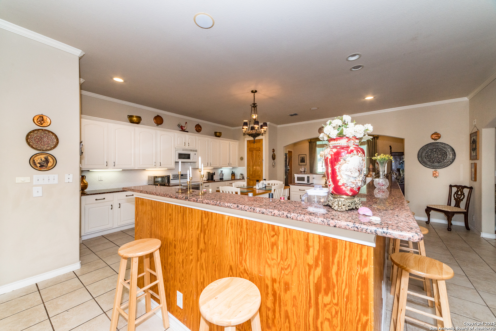 7226 North Vandiver Road San Antonio, TX 78209 - Photo 26 of 59 a kitchen with granite countertop a sink cabinets and window