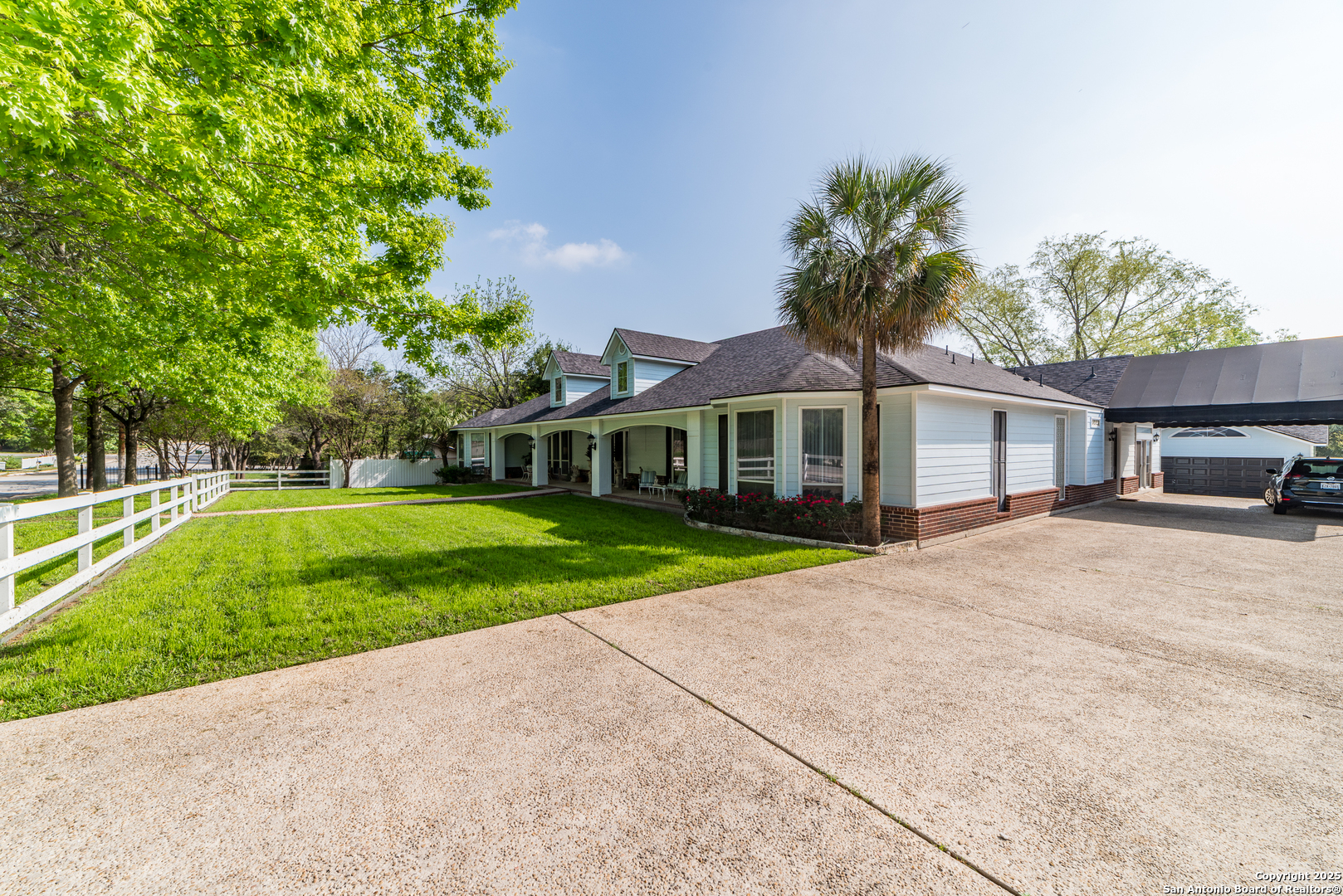 7226 North Vandiver Road San Antonio, TX 78209 - Photo 6 of 59 a front view of a house with a yard and trees